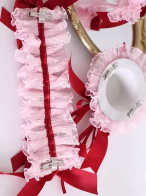Back view and flat lay details of pink lace Lolita headdress showing ruffled lace trim wine red satin ribbons and metal spring clip fasteners