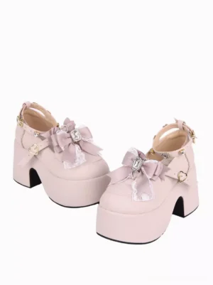 Sweet Lolita pink chunky heel platform pumps side three-quarter profile showcasing lace-trimmed bow and heart-shaped metal hardware details
