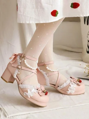 Pink sweet lolita sandals side view showing chunky heel cross ankle straps and strawberry decorations