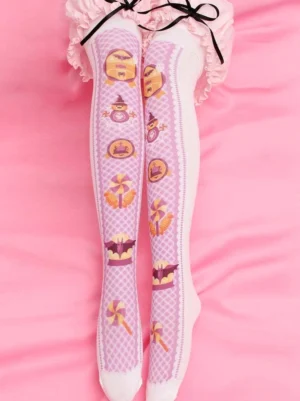 Sweet Lolita pink velvet thigh-high stockings with white lattice pattern and spooky cute prints including tombstones lollipops and bats, worn with pink frilly skirt in full leg view