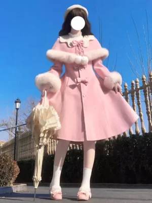 Sweet lolita winter overcoat soft pink with white faux fur trim and bow embellishments full body front view outdoor styling