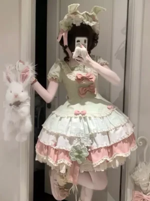 Sweet lolita short sleeve dress pink green plaid ruffled lace front mirror selfie view with plush rabbit handbag and bow details