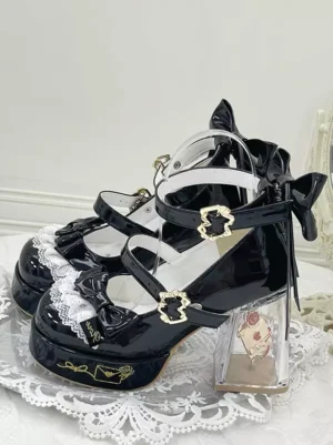 Sweet lolita platform pumps with delicate lace detailing and back bow accent, showcasing printed transparent block heel and gold flower buckles on lace backdrop