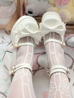Top-down close-up view of white sweet lolita chunky heel pumps worn with lace pattern stockings, featuring decorative dual ankle straps and front bow detail on themed plush toy background