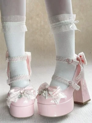 Front perspective of pink Sweet Lolita chunky heel pumps with dual ankle straps, high-gloss PU finish, paired with white ruffled edge socks for authentic lolita coordinate