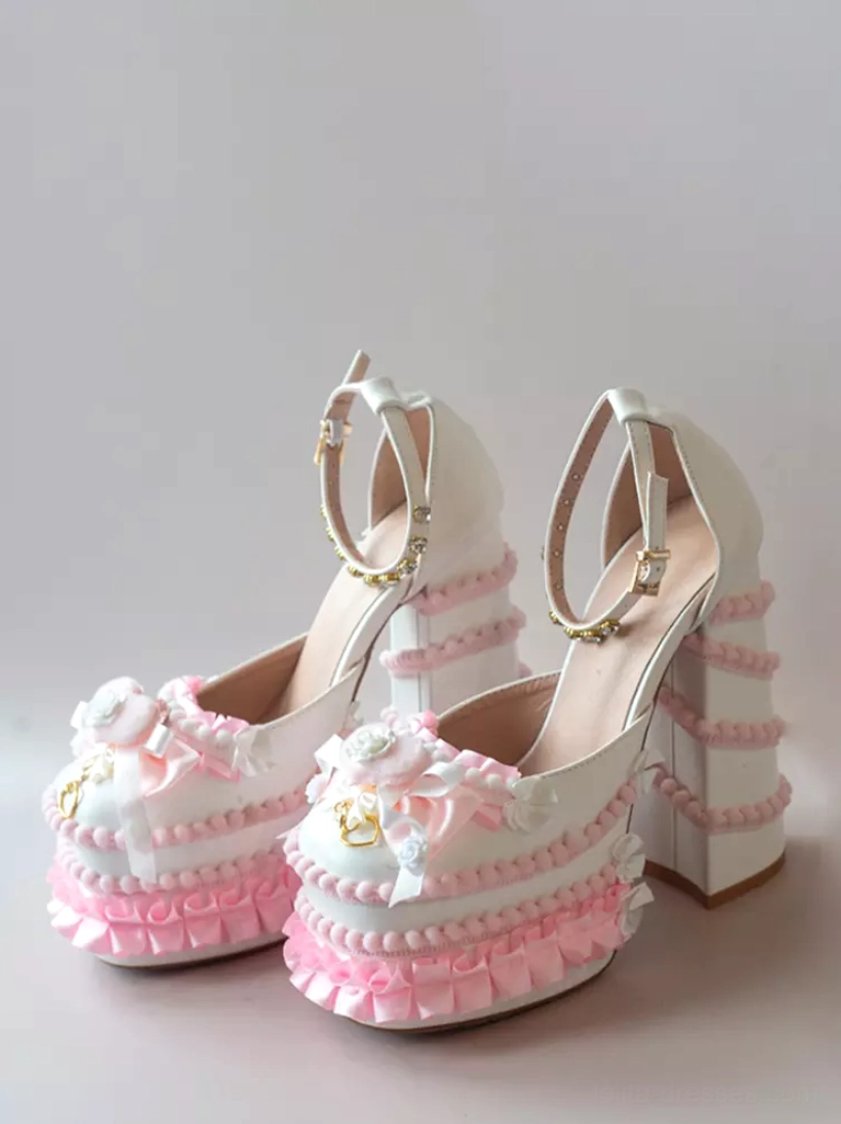 Two-tone Sweet Lolita platform pumps side front view of shoe pair showing white-to-pink gradient, ruffled trims, floral front ornament, ankle strap embellishment