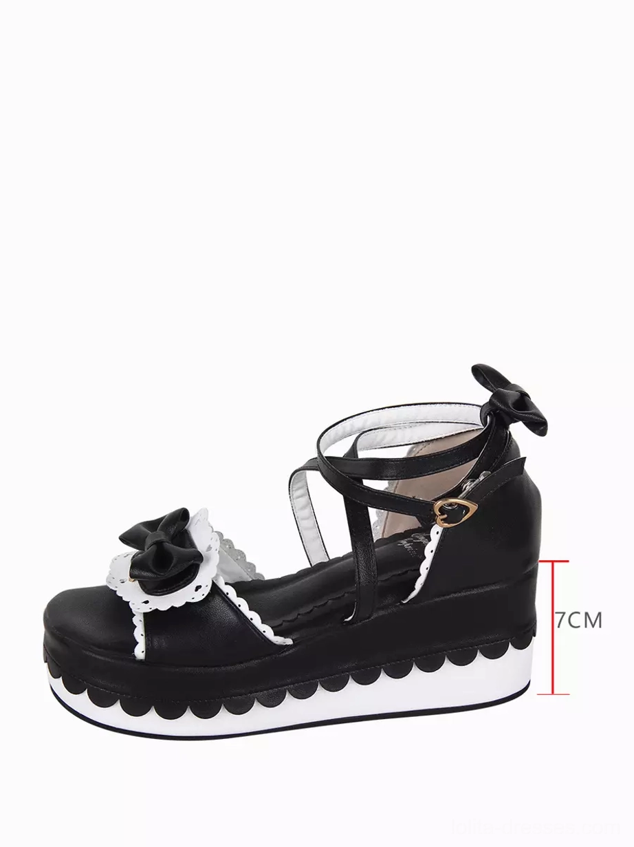 Single Sweet Lolita platform shoe side profile view highlighting seven centimeter thick scalloped sole marked measurement, heart-shaped strap buckle, and mid-wedge heel construction