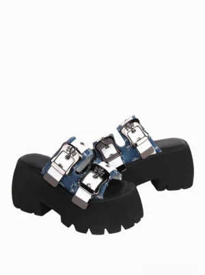 Three-quarter side view of sweet lolita sky blue platform sandals pair showing silver metal adjustable buckle straps and thick jagged edge platform outsole detail