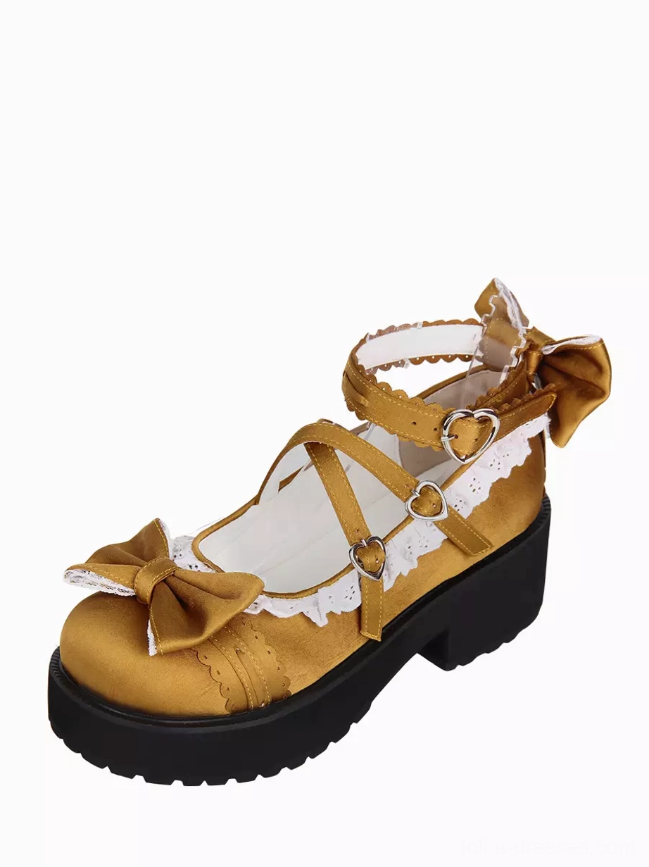 Lolita shoes side profile showing cross ankle straps rear bow detail thick wedge heel and heart buckle design