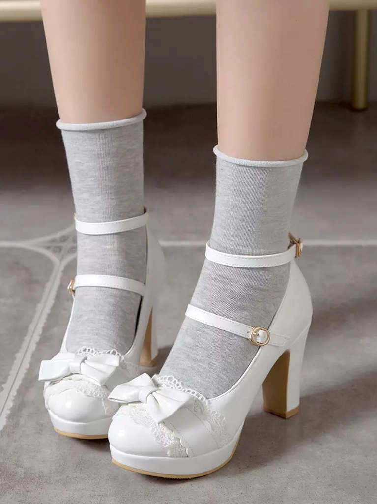 Sweet Lolita white platform shoes with bow and lace embellishments worn with grey socks indoor casual coordinate front low angle view