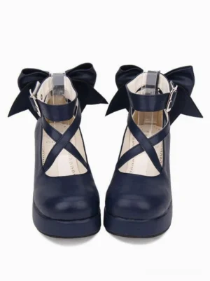 Navy blue Lolita platform wedge shoes with cross-strap buckle fastener and decorative ankle bow, front direct view