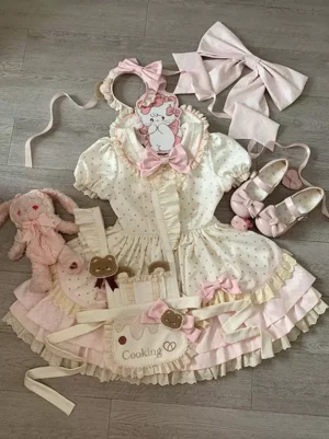 Sweet lolita polka dot one-piece dress flat lay with matching accessories set pink bow collar cooking apron Mary Jane shoes hair bows cat clip