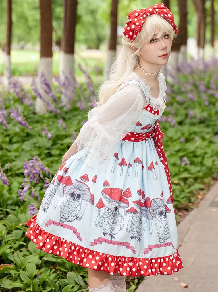 Sweet lolita ensemble with lavender flower background showing ruffled polka dot hem and matching red bow headdress