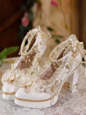 Sweet lolita ecru white chunky heel pumps with gold trims and lace bow decorations front three-quarter view