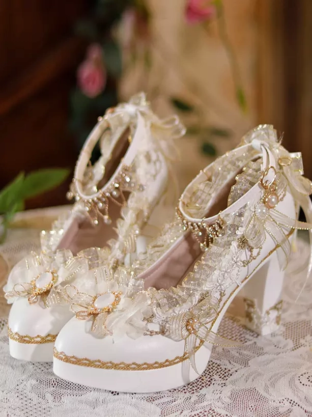 Sweet lolita ecru white chunky heel pumps with gold trims and lace bow decorations front three-quarter view