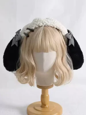 Sweet Lolita puppy ear beret in ecru fleece with black plush ears and gingham bows, front view on mannequin with blonde wavy hair