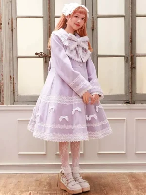 Light purple Lolita coat side profile view showing cuff lace trim and large decorative bow collar
