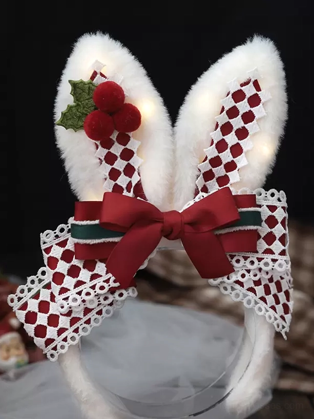 Christmas sweet lolita rabbit ear headband flat lay close-up showing twinkling LED lights integrated in fluffy ears, red-green striped bow, detailed plaid pattern, festive holiday decoration elements