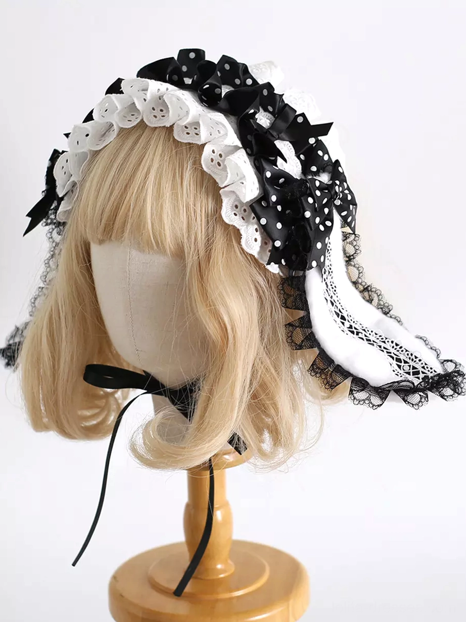 Long hanging rabbit ears with layered lace and bow accents, neck ribbon tie detail, right side three-quarter view of Gothic Lolita headwear