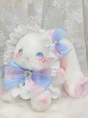 Sweet lolita handbag front eye-level view featuring adorable white rabbit with ruffled collar, gradient pink-blue hanging rhinestone bow, long droopy ears and sparkling crystal blush eyes