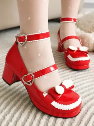 Red patent leather sweet lolita chunky heel pumps with heart buckles and decorative bow detailing side view close-up showing polka dot sheer socks