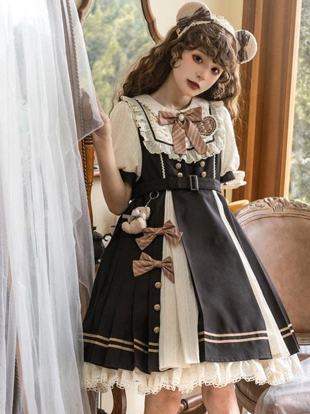 Sweet Lolita short sleeve dress partial side view showing faux double-breasted waist details and bow decorations on pleated skirt