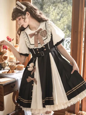 Sweet Lolita dress side profile showing pleated skirt and teddy bear pendant, styled with cat ear hairband and afternoon tea dessert backdrop