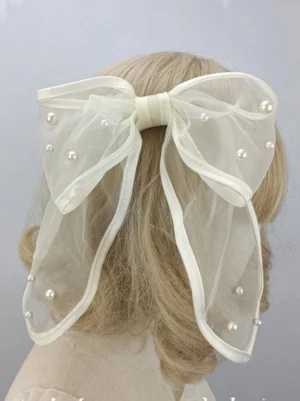 Ecru off-white sheer mesh bow lolita headdress with scattered faux pearl embellishments, viewed from back on blonde mannequin, sweet rococo style hair accessory