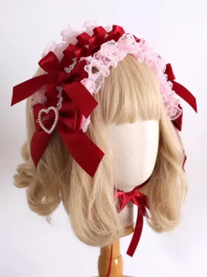 Sweet Lolita rococo pink lace bow headdress with wine red satin ribbons and heart rhinestone pendant worn on mannequin front view