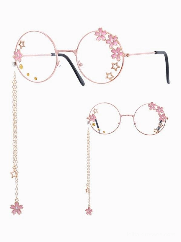 Pair of sweet lolita round frame glasses with rose gold metal frames, pink sakura flower decorations, star charms, and matching chain pendants displayed in flat lay on white background