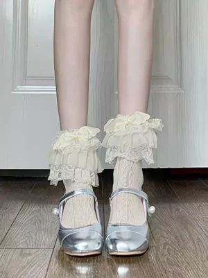 Sweet Lolita white ruffle ankle socks with layered lace trim paired with silver Mary Jane shoes front view direct shot