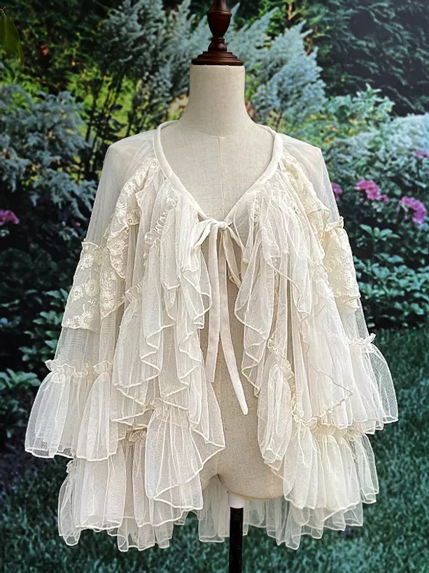 Cream ruffled lolita cape top accessory with tie-front v-neck and sheer ruffled tulle layers for sweet coordinate styling