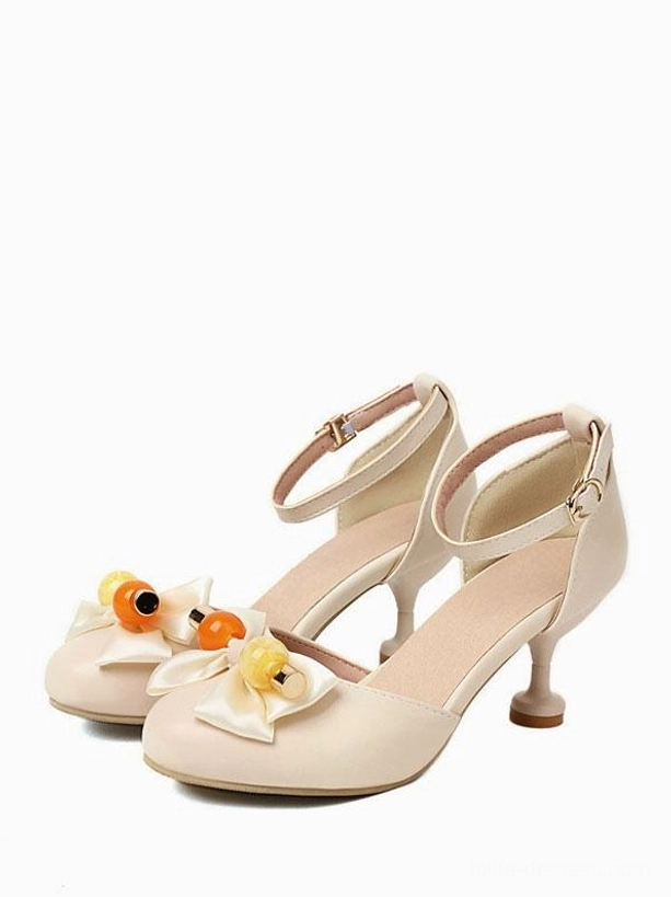 Ecru white Sweet Lolita sandals round toe front paired view with satin bow embellished with fruit-shaped beads, kitten heel, and ankle buckle closure strap