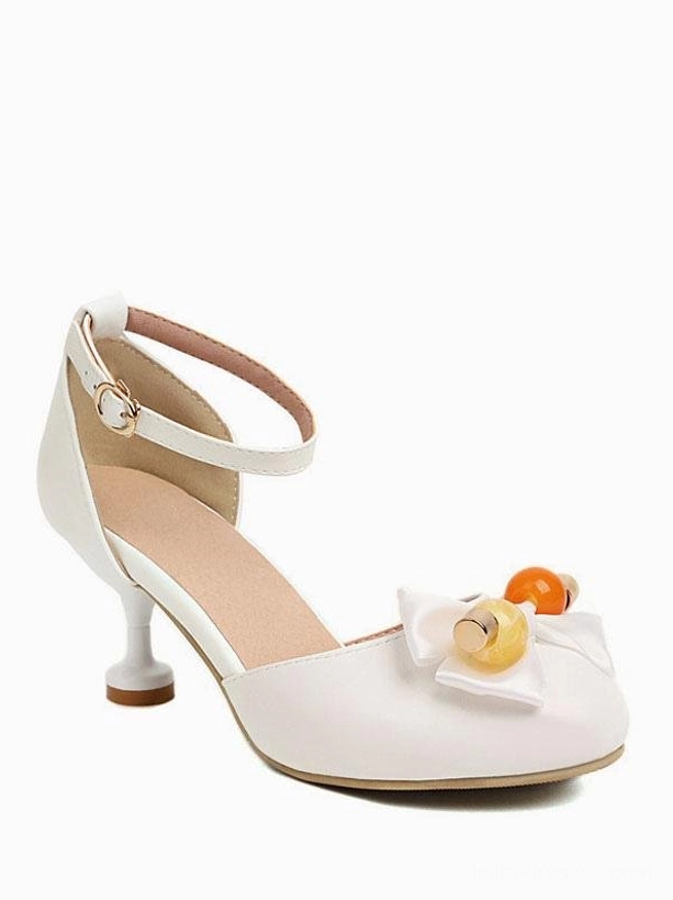 Sweet Lolita round-toe sandals side and rear three-quarter view displaying kitten heel, ankle strap buckle closure, and decorative bow with fruit beads on white background
