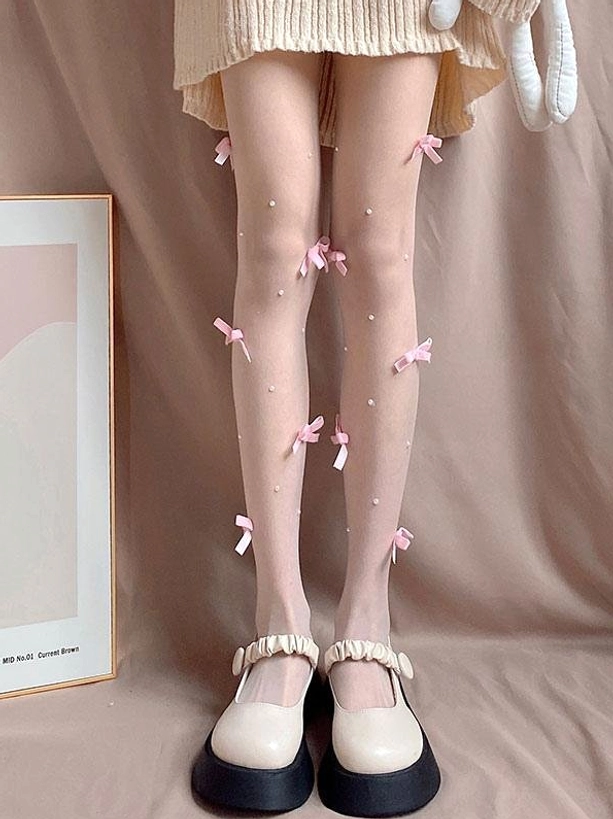 Sweet lolita sheer tights full front leg view with pink satin bows and faux pearl embellishments skin-toned fabric lace skirt hem