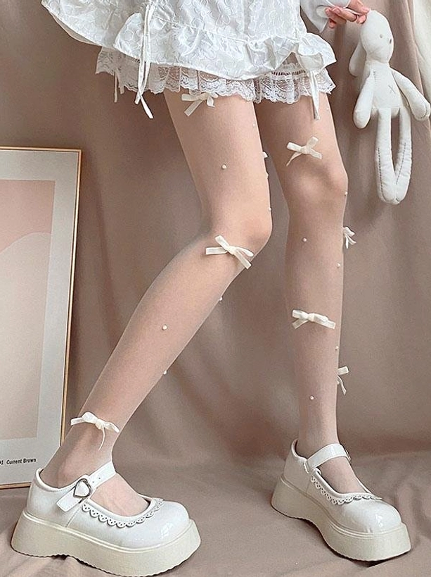 Sweet lolita sheer tights side leg view off-white ribbon bows scattered pearls sheer stockings white ruffled lace skirt platform shoes
