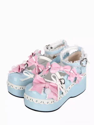 Sweet lolita platform shoes light sky blue patent leather pink bows round toe front oblique view