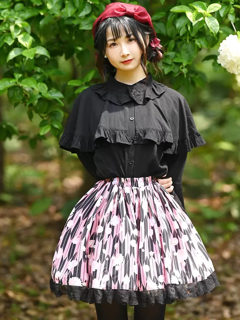 Sweet lolita skirt detail shot showcasing black lace hem ruffles pink floral print polyester fabric quality
