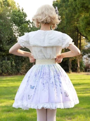 Lolita skirt back view displaying beige waistband and layered white lace trim hem pastoral outdoor setting