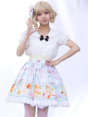 Lolita skirt with ruffled hem and black bow brooch detail front three-quarter view white background short puffed sleeves overlay