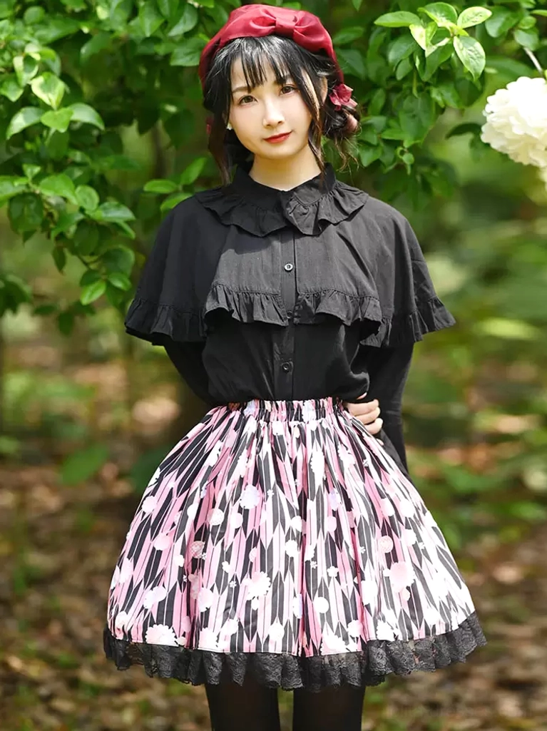 Sweet lolita skirt set front three-quarter view model hands on hips black lace trimmed floral skirt