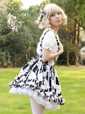 Lolita skirt with floral print and white ruffle underskirt, side three-quarter angle showing skirt volume and silhouette, outdoor lawn background