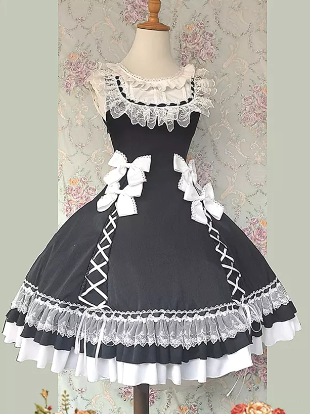 Black sweet lolita sleeveless dress with multi-layer ruffled hem, decorative bows, and lace collar displayed on dress form, front view showing full silhouette
