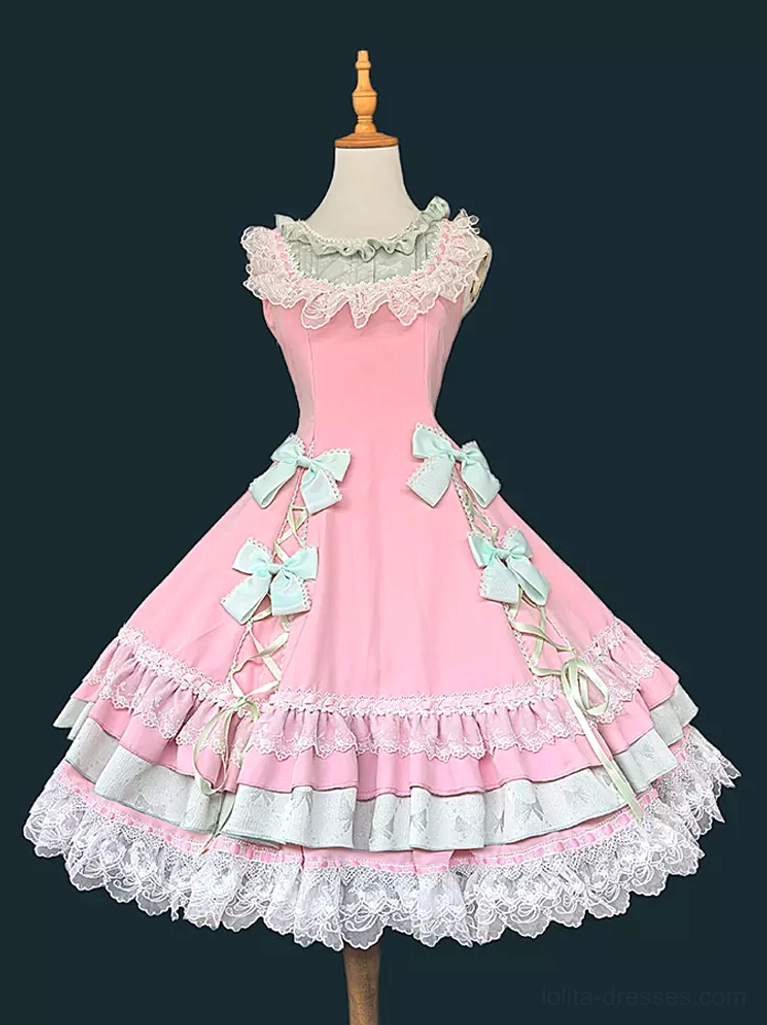 Pink sweet lolita jumper dress with sleeveless construction and multi-layer ruffled hem, front display showing lace collar and decorative bow details