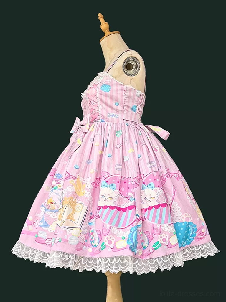 Sweet lolita sleeveless dress side angle showing pink base, decorative side bow sash, delicate lace hem, and full carousel dessert print pattern