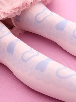 Close-up side view of sweet lolita stockings on leg, displaying soft printed heart and bow motifs in light blue, demonstrating authentic over-the-knee length and comfort fit