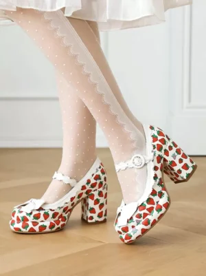 Sweet lolita strawberry print white chunky heel pumps with front white bow appliqué and ankle strap buckle, front pair view on wooden floor