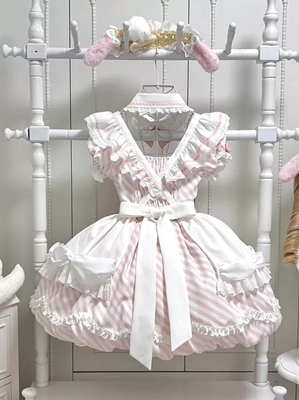 Pink and white vertical striped Sweet Lolita apron dress with ruffled trim cross v-neckline and white waist sash full front view