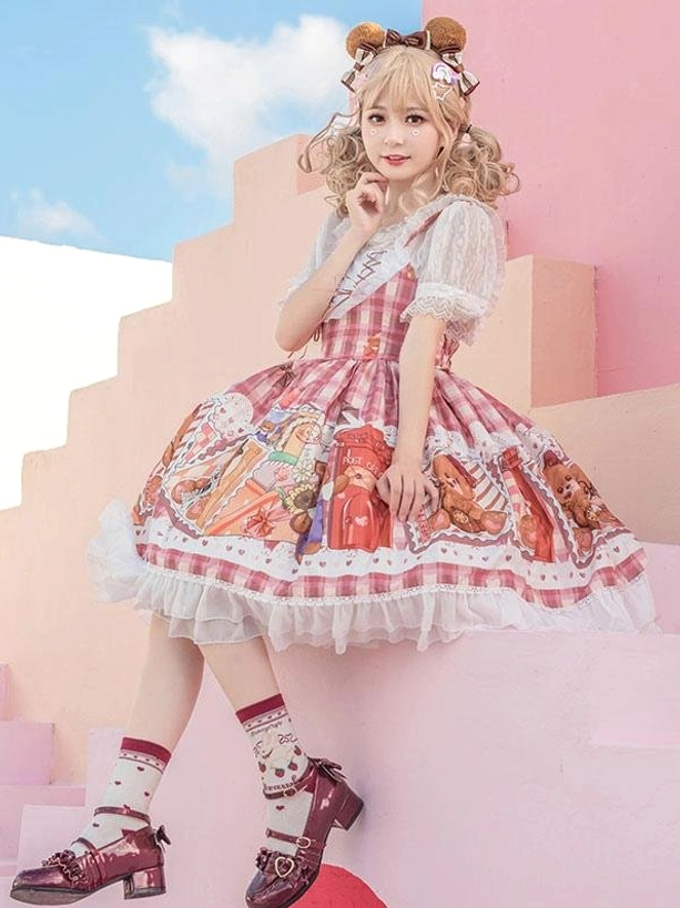 Sweet lolita sleeveless dress with teddy bear print gingham pattern worn on pink outdoor stairs with blonde model in bear hair clips showing front perspective view
