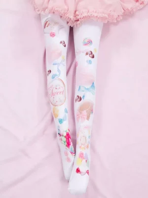 Sweet Lolita white thigh high stockings with pastel candy and dessert prints displayed on pink fabric background, overhead flat lay view showcasing full design